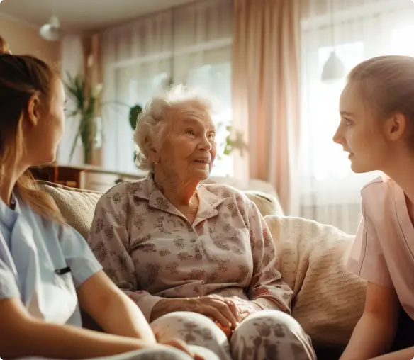 Helpful caretakers helping hospice patient